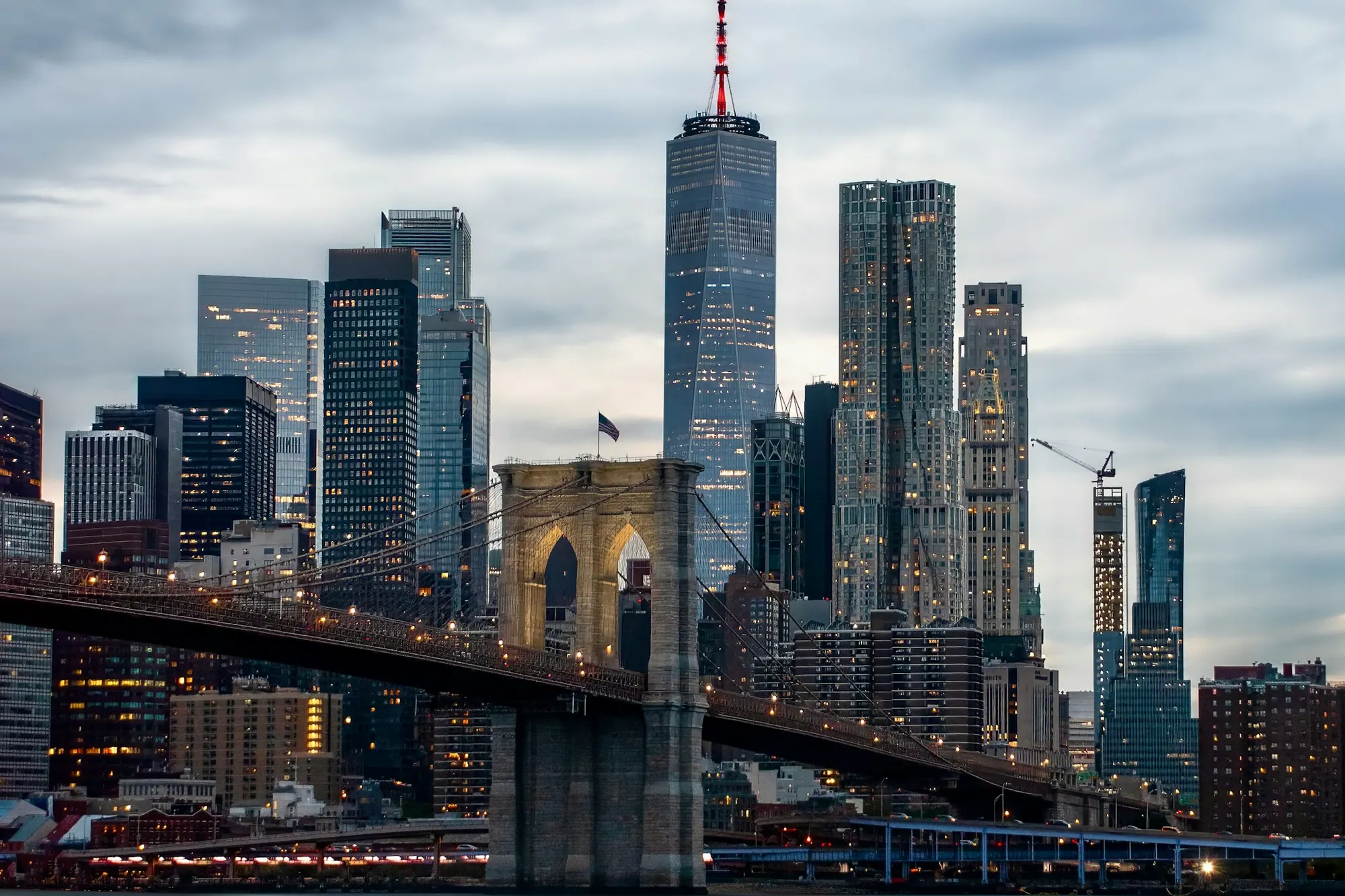 The Brooklyn Bridge and the Lower Manhattan skyline at dusk